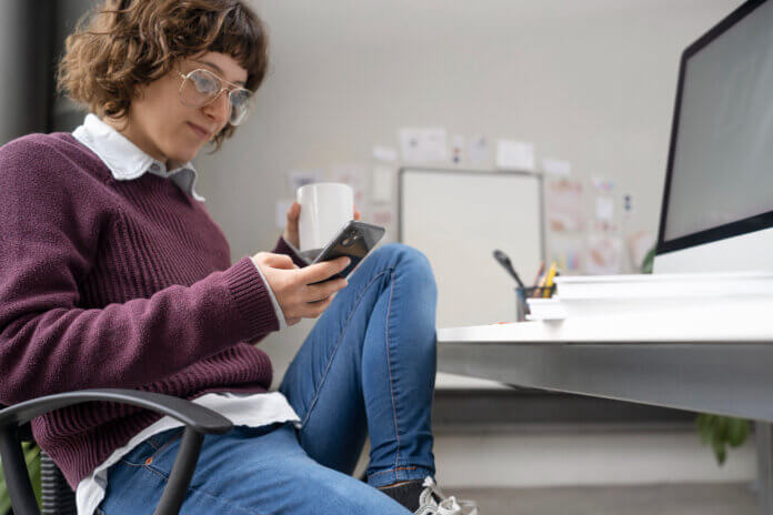 Person playing video games on phone